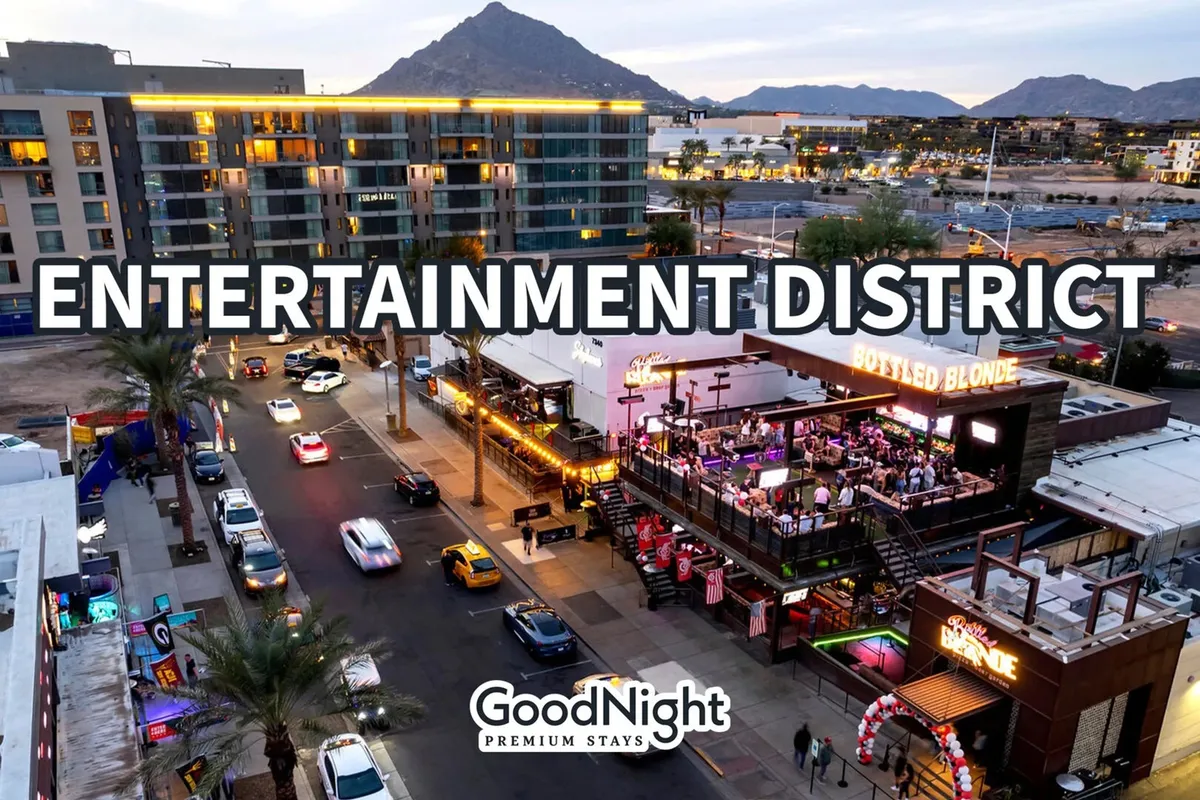 The exterior of Scottsdale’s bustling Entertainment District, featuring signature signage for Bottled Blonde, busy streets, and a mountain backdrop. The area is alive with people heading to nightlife venues, restaurants, and shops, embodying the district's energetic and social vibe.